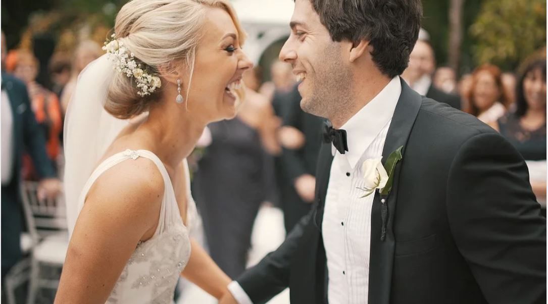 bride and groom smiling